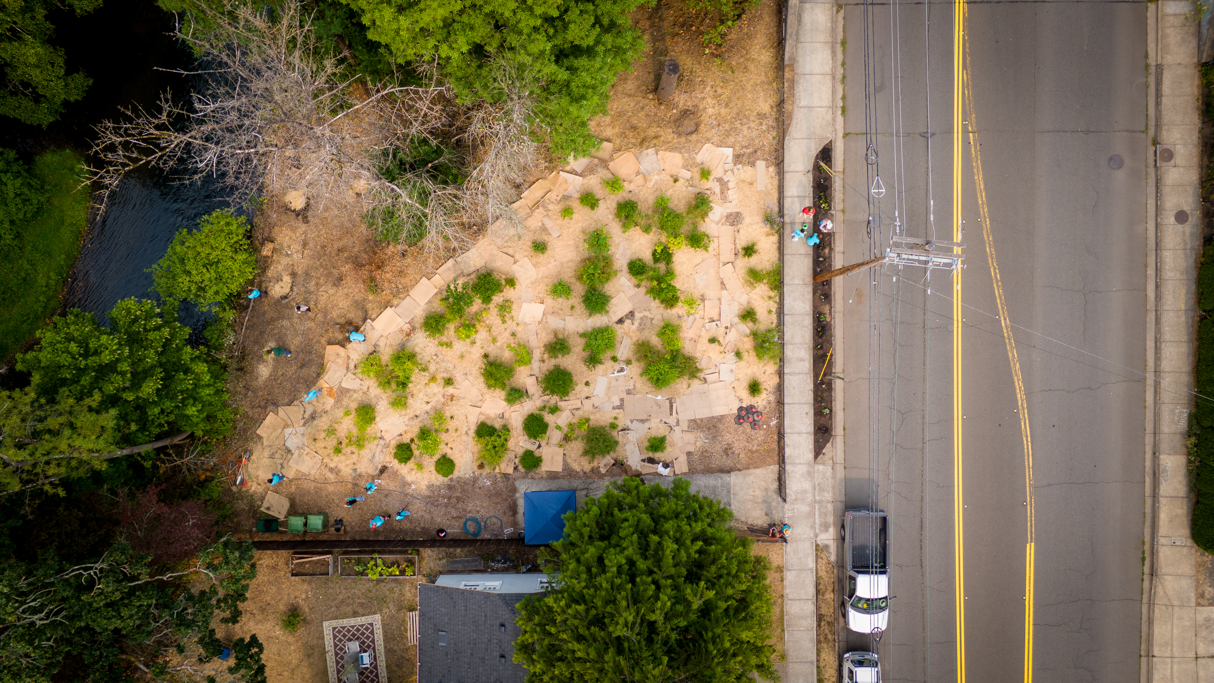 Aerial view of a green infrastructure work site beside a city street